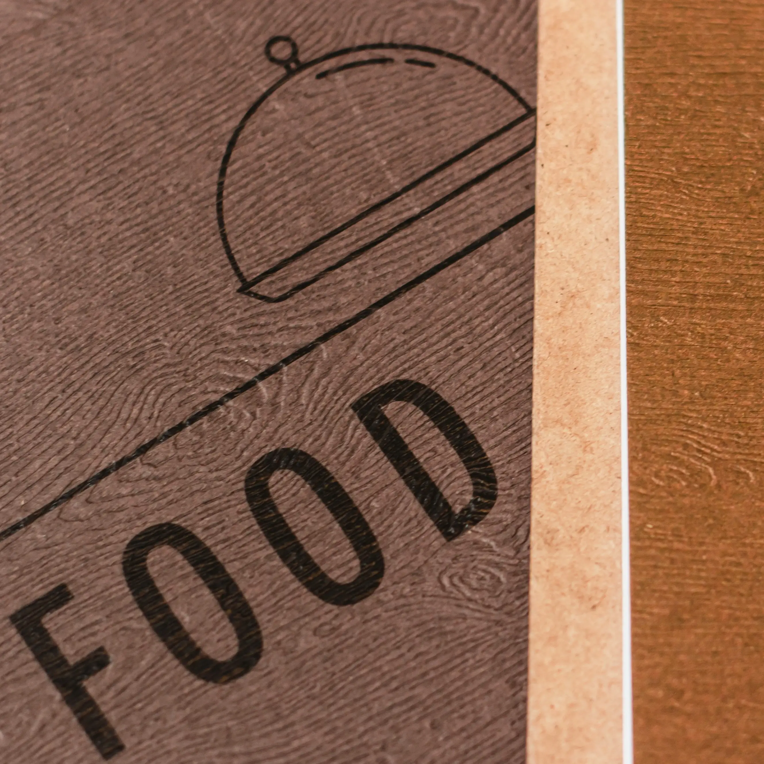 Brown wooden-effect menus with text FOOD